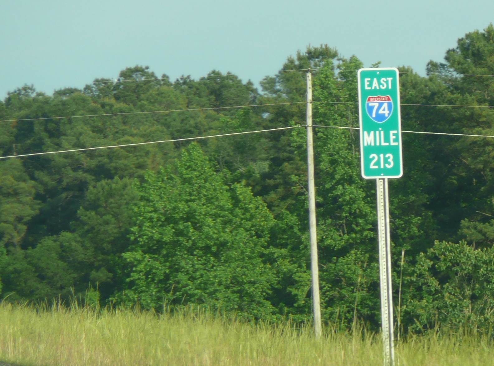 Photo of I-74 mile markers with I shield between exits 210 and 213, May 
2009