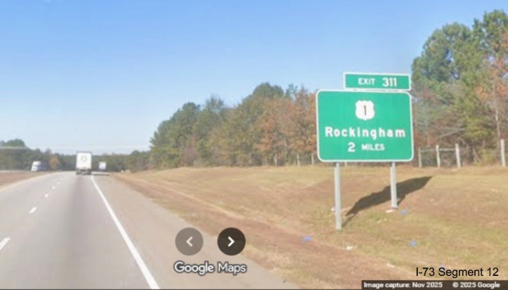 Image of new ground mounted 2 Miles advance sign for US 1 exit on I-74/US 74 West  
	in Rockingham, Google Maps Street View, November 2025