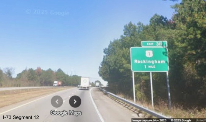 Image of new ground mounted 1 Mile advance sign for US 1 exit on I-74/US 74 West  
	in Rockingham, Google Maps Street View, November 2025