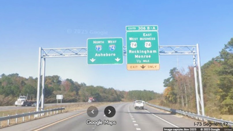 Image of overhead signage approaching the exit for US 74/Business 74 on 
	I-74/US 74 West in Rockingham, Google Maps Street View, November 2025