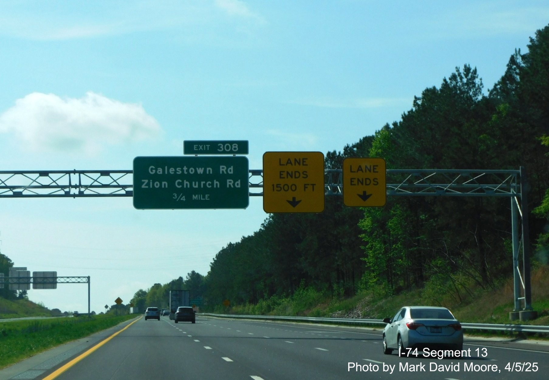 Image of new signage for former Cordova exit on I-74/US 74 East after 
    interchange with the Rockingham Bypass by Mark David Moore, April 2025