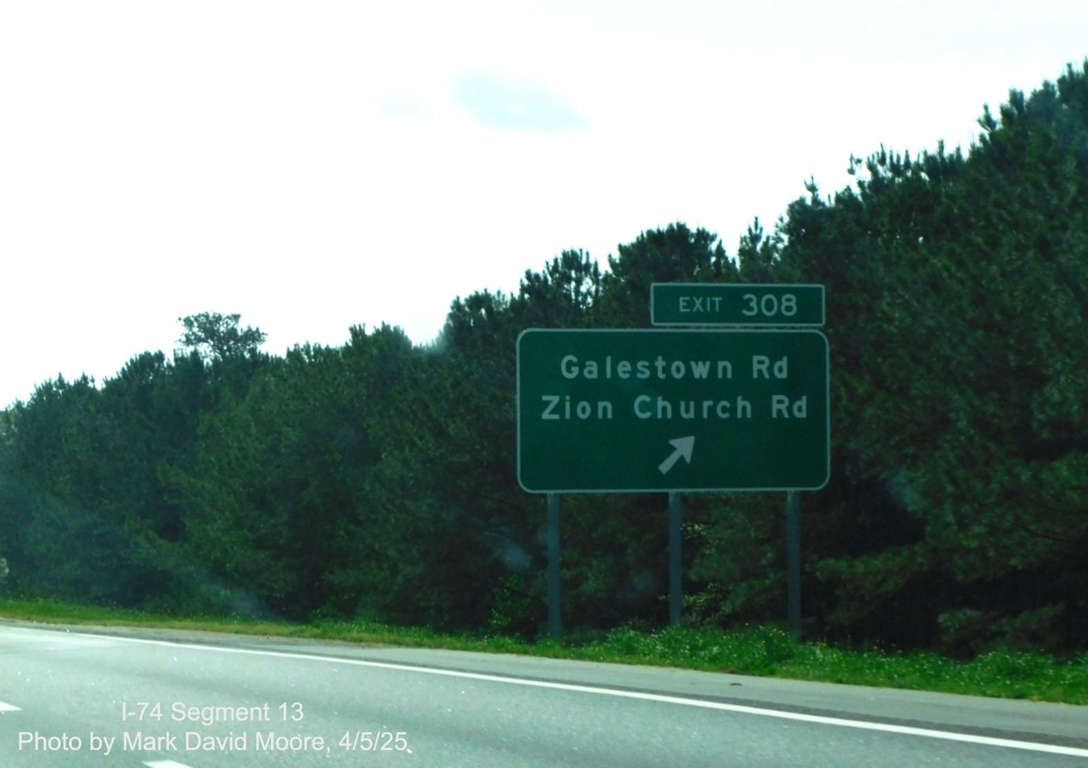 Image of new exit signage for former Cordova exit on I-74/US 74 East after
		interchange	with the Rockingham Bypass by Mark David Moore, April 2025
