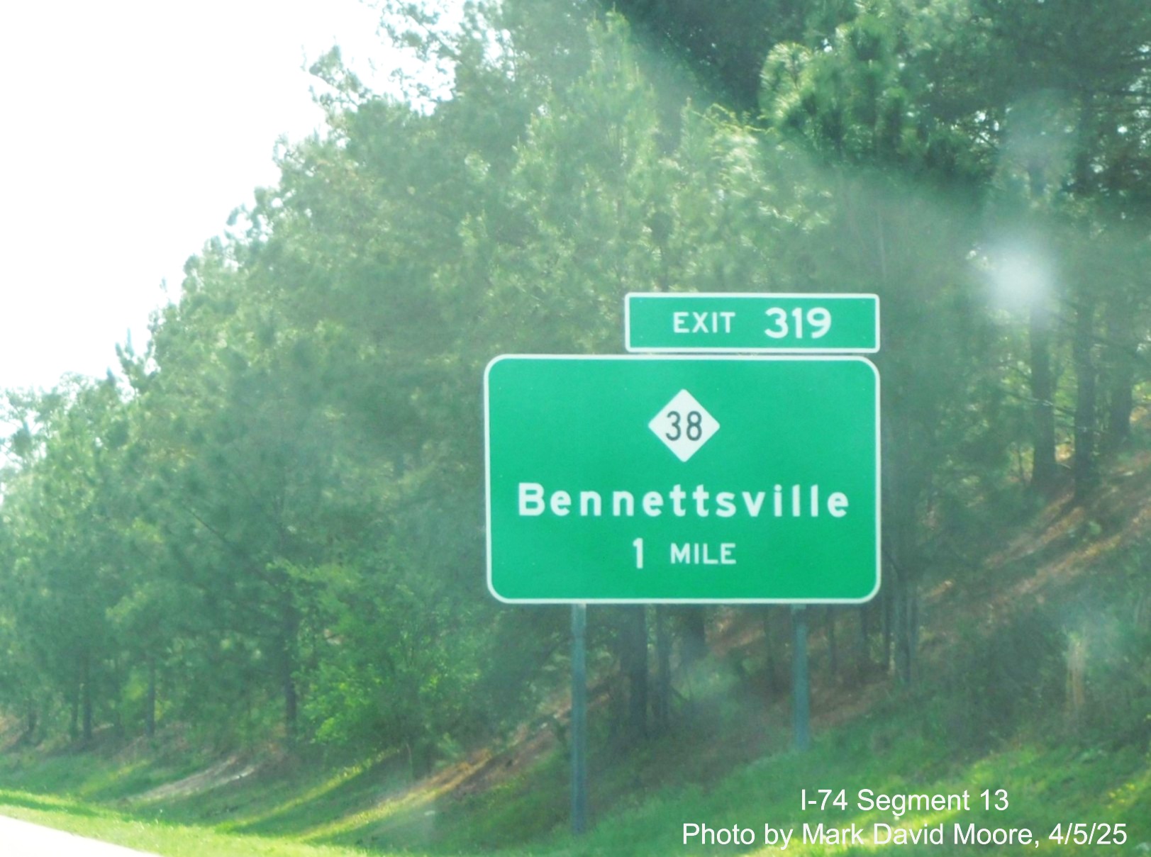 Image of new 1 mile advance sign for the NC 38 exit on I-74/US 74 East in
		Hamlet by Mark David Moore, April 2025