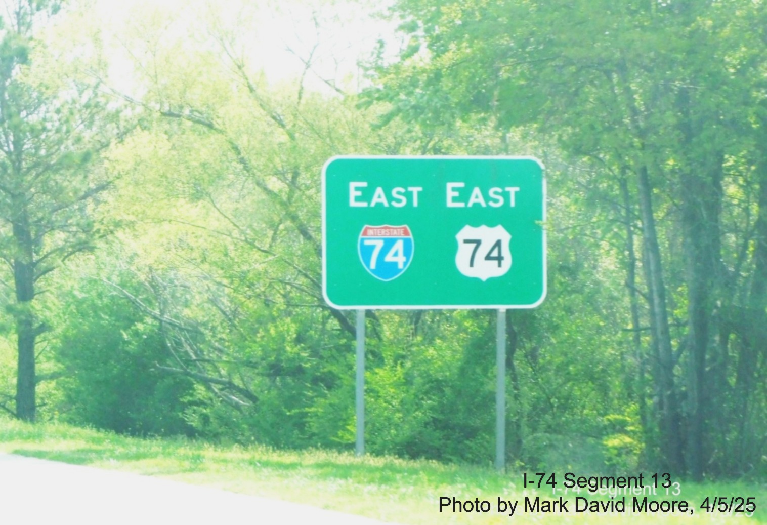 Image of new Easr I-74/US 74 East reassurance marker sign in Hamlet,
	  by Mark David Moore, April 2025