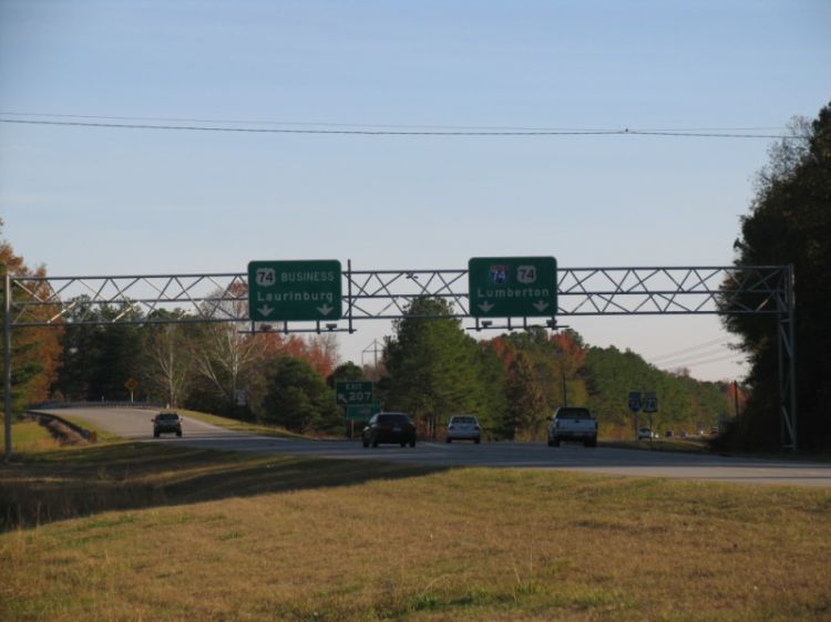 Photo of the first overhead signs for the Laurinburg Bypass showing
I-74 shields in Dec. 2007, courtesy of Adam Prince