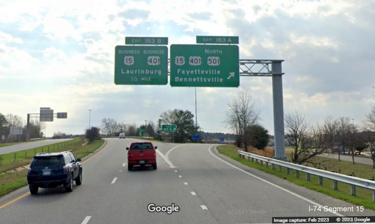 Image of new overhead signage at ramp for US 15/401/US 501 North exit on US 74 (Future I-74) East 
        in Laurinburg, Google Maps Street View, February 2023