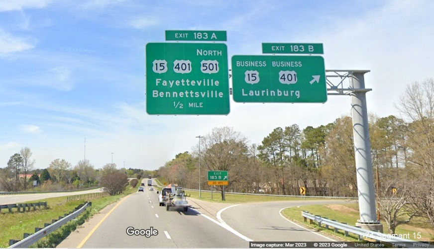 Image of new overhead signs at ramp for Business US 15/401 exit on US 74 (Future I-74) West 
        in Laurinburg, Google Maps Street View, March 2023