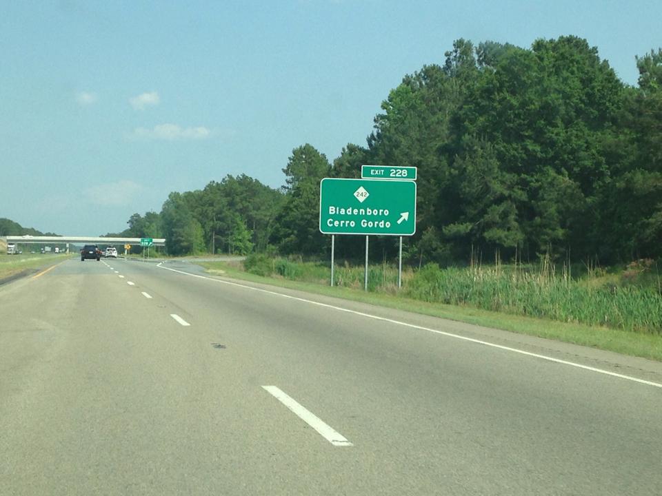 Photo of sign for NC 242 Exit on US 74 (Future I-74) East in
Columbus County. Photo courtesy of Chris Curley