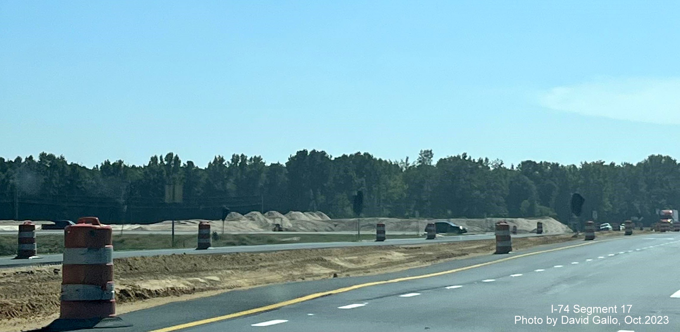 Image showing median construction and soil placement along NC 72 West from US 74 East near Boardman in interchange 
       construction area, by David Gallo, October 2023