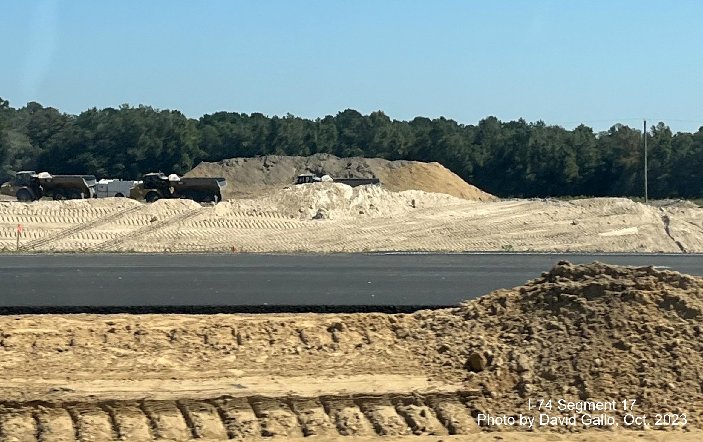 Image of construction near NC 72 intersection on US 74 West near Boardman from eastbound lanes 
       in interchange construction area, by David Gallo, October 2023