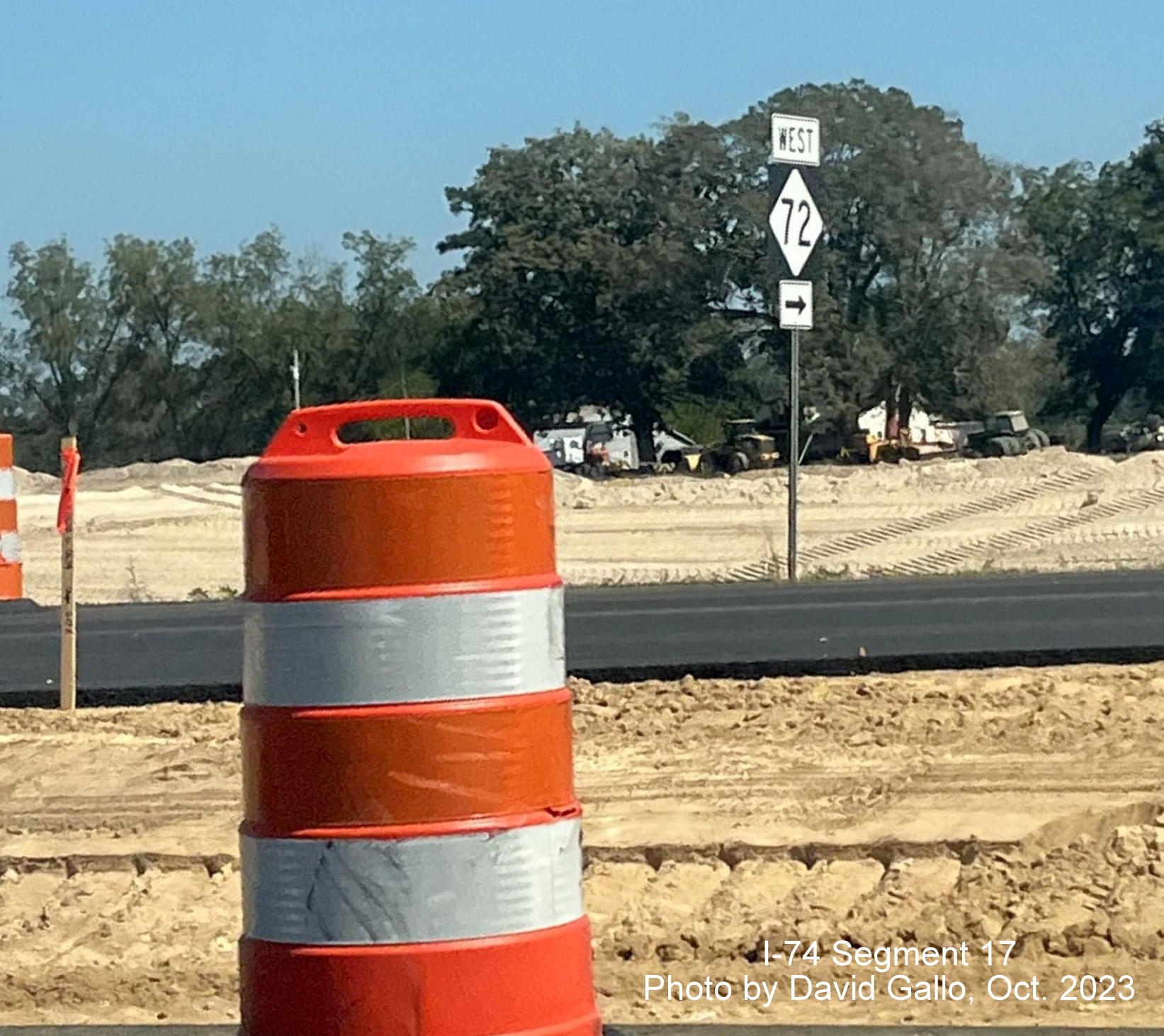 Image of West NC 72 trailblazer near intersection on US 74 West near Boardman as seen from
       eastbound lanes in interchange construction area, by David Gallo, October 2023