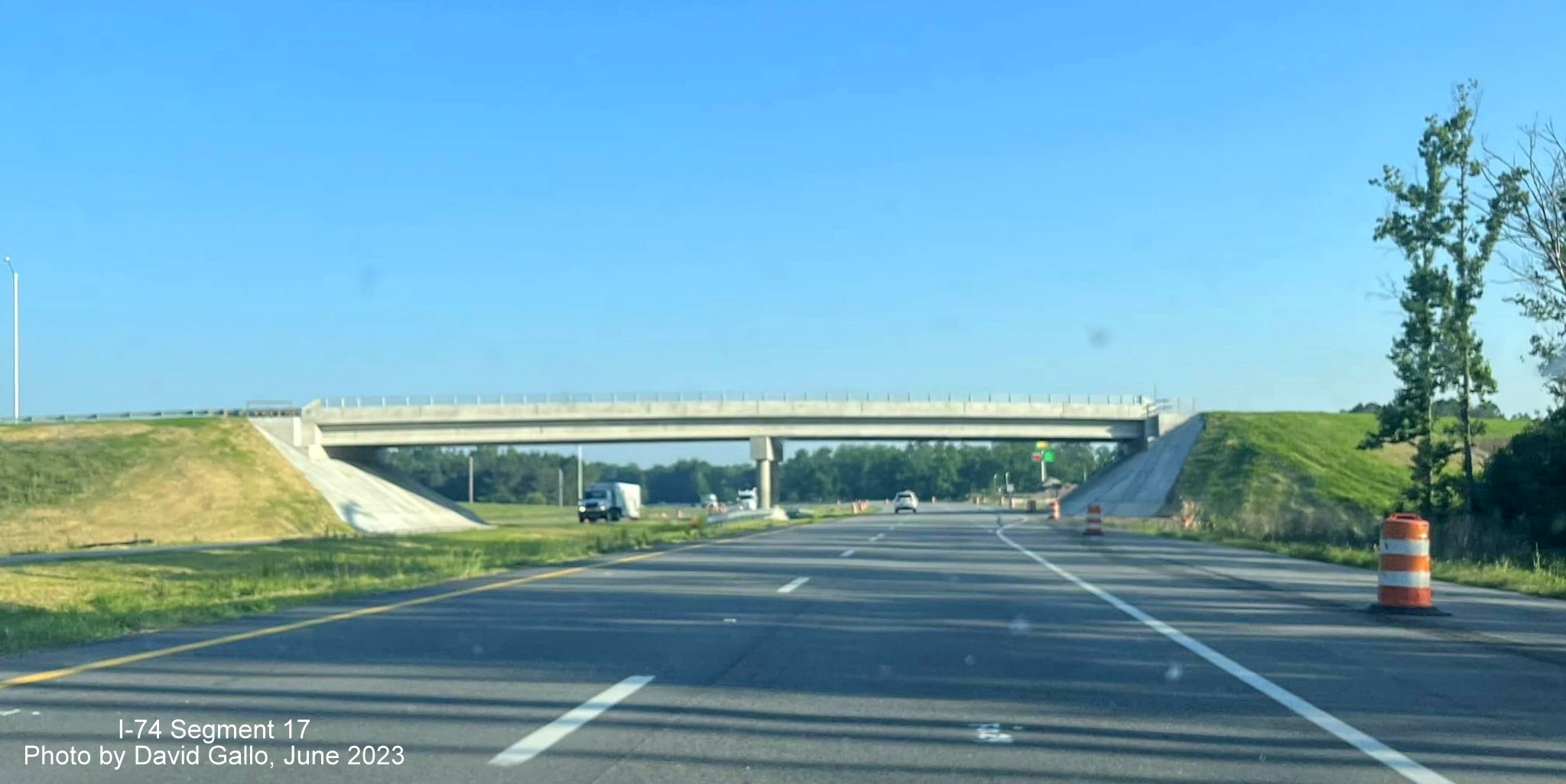 Image of finished US 74 (Future I-74) West roadway heading under Old Boardman Road bridge, by 
        David Gallo, June 2023