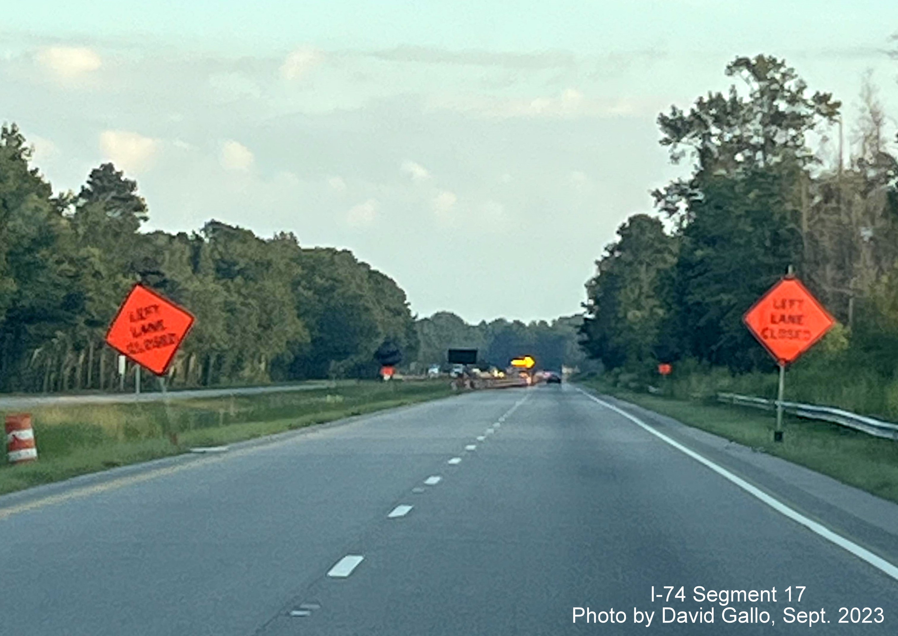 Image of signs warning of approaching left lane closure approaching the NC 72 intersection on 
         US 74 West in interchange project work zone, David Gallo, September 2023