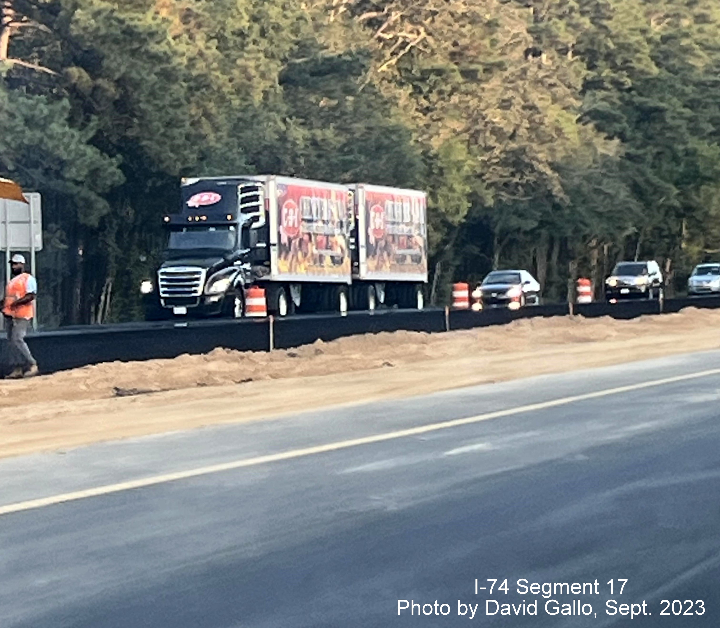 Image of paving along closed left lane closure approaching the NC 72 intersection on 
         US 74 West in interchange project work zone, David Gallo, September 2023