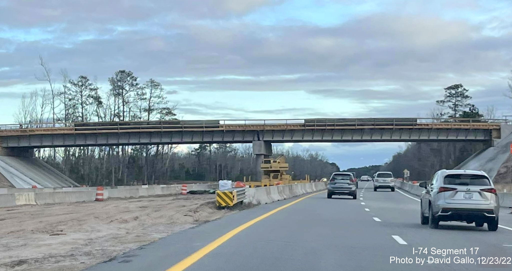 Image of approaching bridge under construction in work zone for Boardman interchange project on US 74 East, by David Gallo, 
        December 2022