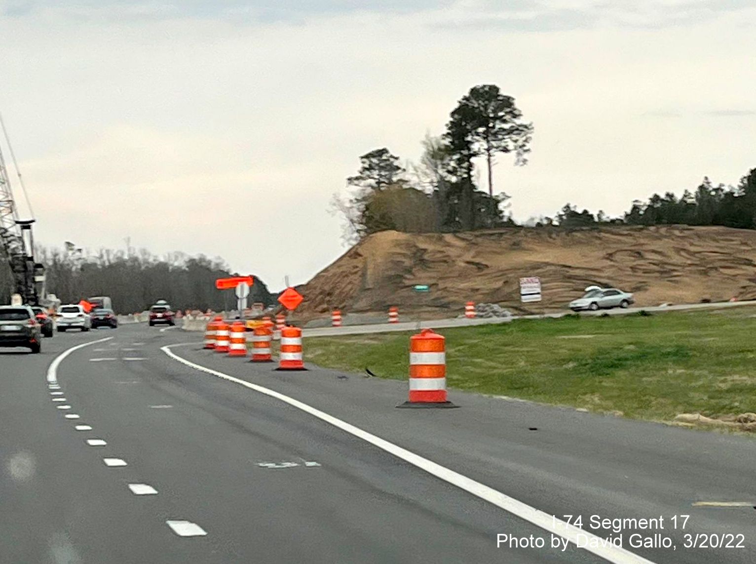 Image of embankment being built for future Old Boardman Road bridge over US 74 (Future I-74), 
        by David Gallo, March 2022
