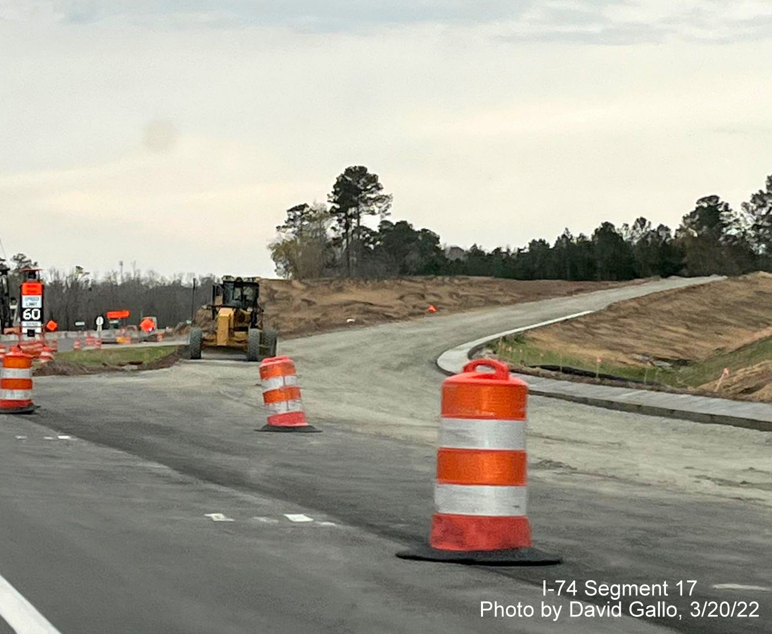 Image of future exit ramp for future Old Boardman Road from US 74 (Future I-74) East, 
        by David Gallo, March 2022