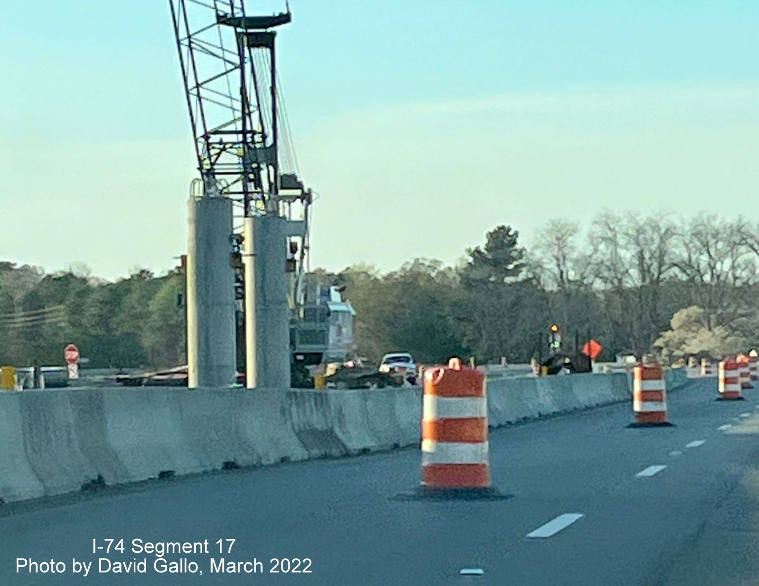 Image of closeup of crane helping construct supports for future Boardman interchange bridge on US 74 (Future I-74) West
        , by David Gallo, March 2022
