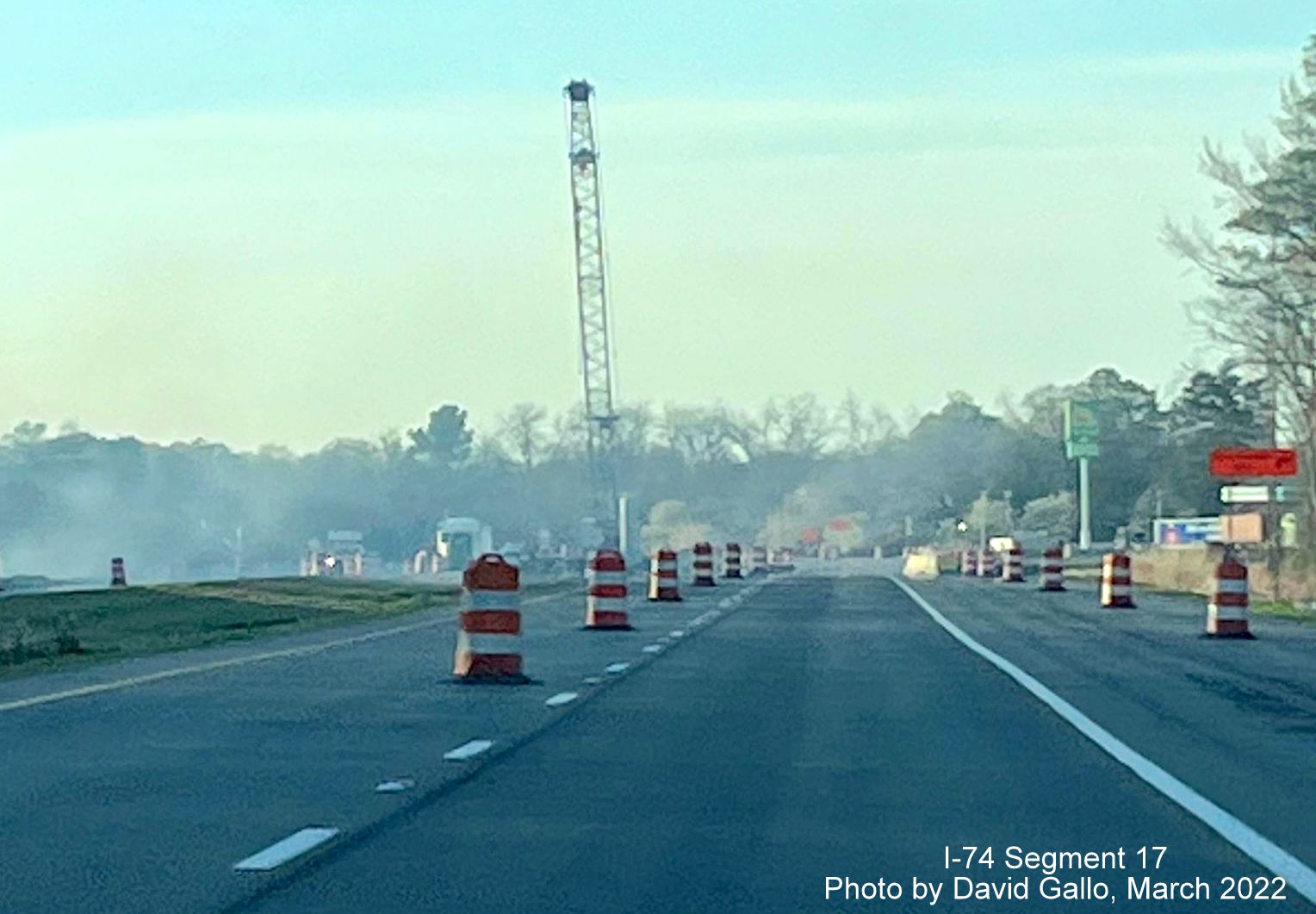 Image of traffic approaching Boardman interchange construction site with crane for bridge construction
        in the distance, by David Gallo, March 2022