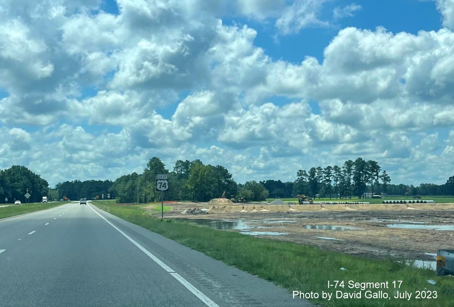 Image of land clearing along US 74 East lanes prior to NC 130 intersection for new interchange work, David Gallo, 
        July 2023