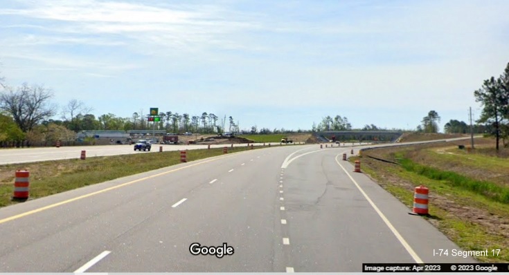 Image of approaching completed exit ramp to Old Boardman Road on US 74/NC 130 East, Google Maps 
        Street View image, April 2023