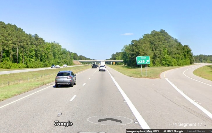 Image of gore sign for NC 242 exit on US 74 (Future I-74) East in 
        Columbus County, Google Maps Street View image, May 2022