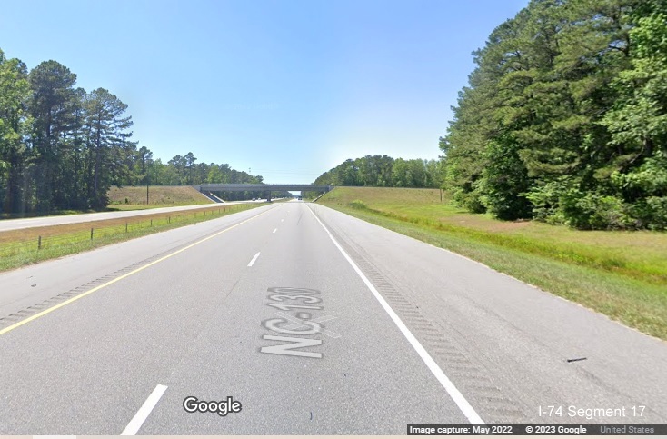 Image of ground mounted 3/4 mile advance sign for NC 242 exit on US 74 (Future I-74) East in 
        Columbus County, Google Maps Street View image, May 2022