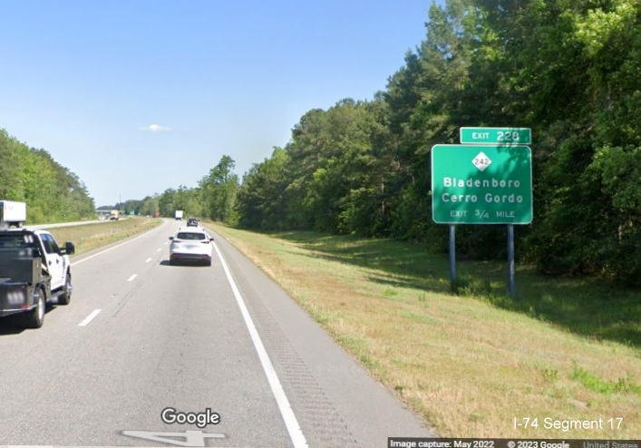 Image of ground mounted 3/4 mile advance sign for NC 242 exit on US 74 (Future I-74) East in 
        Columbus County, Google Maps Street View image, May 2022