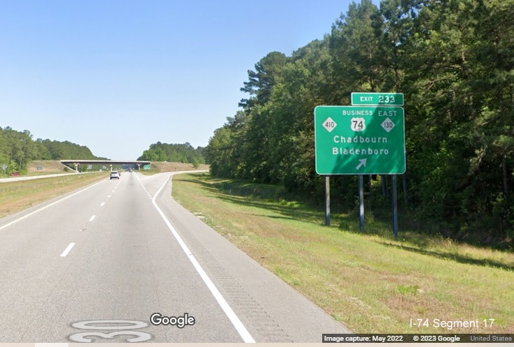 Image of ground mounted ramp sign for NC 410/Business 74/NC 130 East exit on US 74 (Future 
        I-74) East in Columbus County, Google Maps Street View image, May 2022