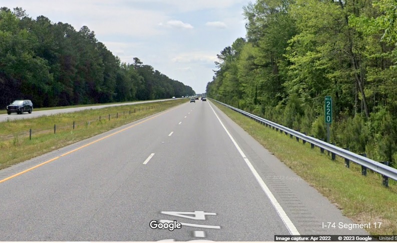 Image of I-74 mileage mile marker on US 74 East (Future I-74) in Robeson County, Google Maps Street View, April 2022The I-74 mileage Mile 220
    marker along US 74 East.