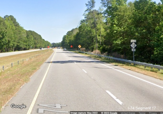 Image of West NC 72 trailblazer approaching intersection, site of future interchange, on US 
          74 East in Orrum, Google Maps Street View, May 2022
