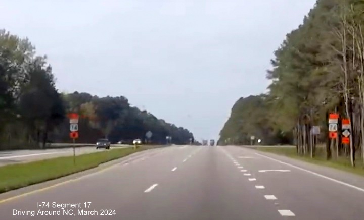 Screen grab image approaching Creek Road intersection with Detour To NC 72 West trailblazer on US 74 
       (Future I-74) West in Robeson County, Driving Around NC, March 2024