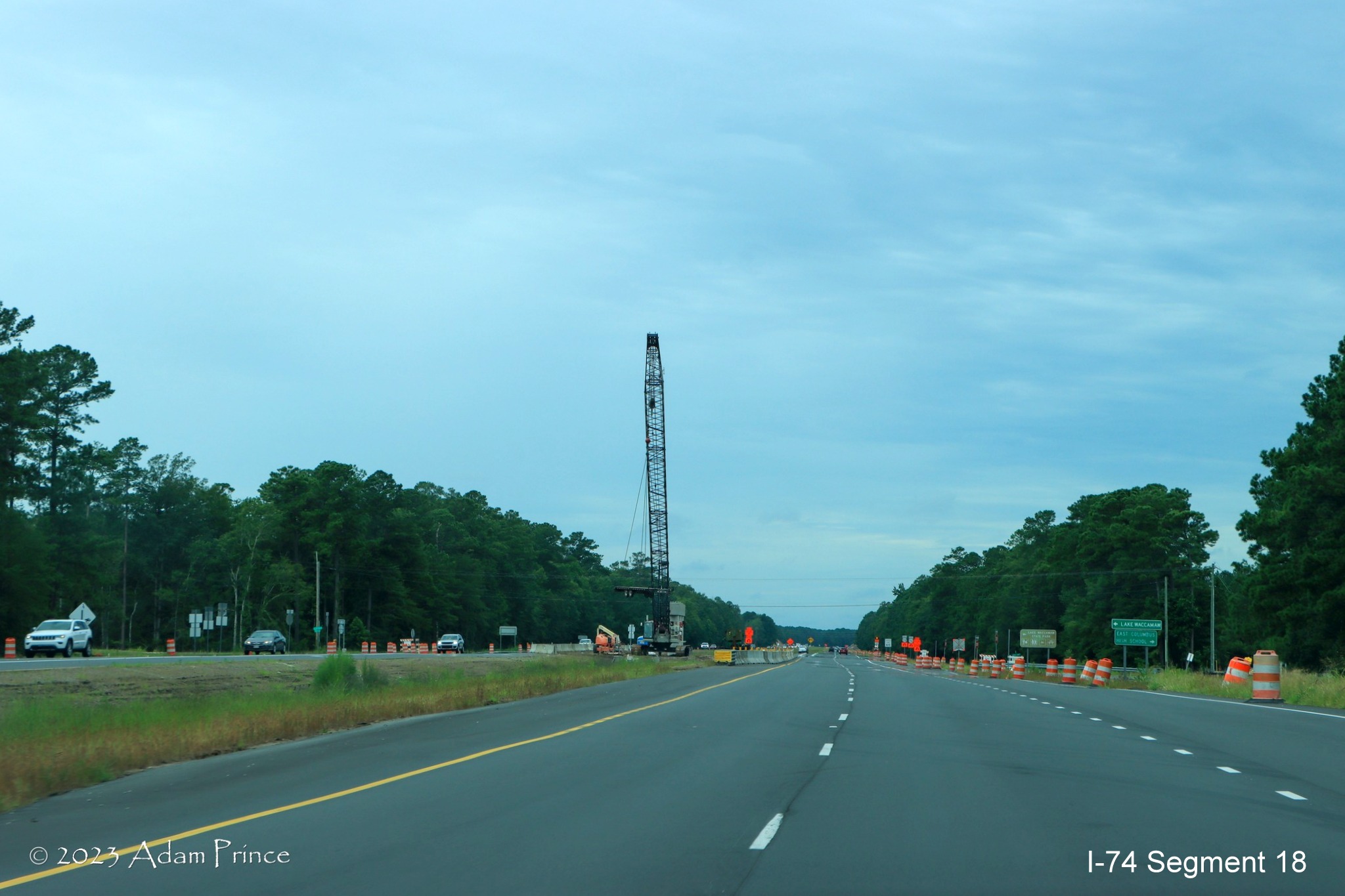 Image of US 74/76 West traffic traveling through future Old Lake Road bridge construction zone in Lake Waccamaw, Adam Prince July 2023