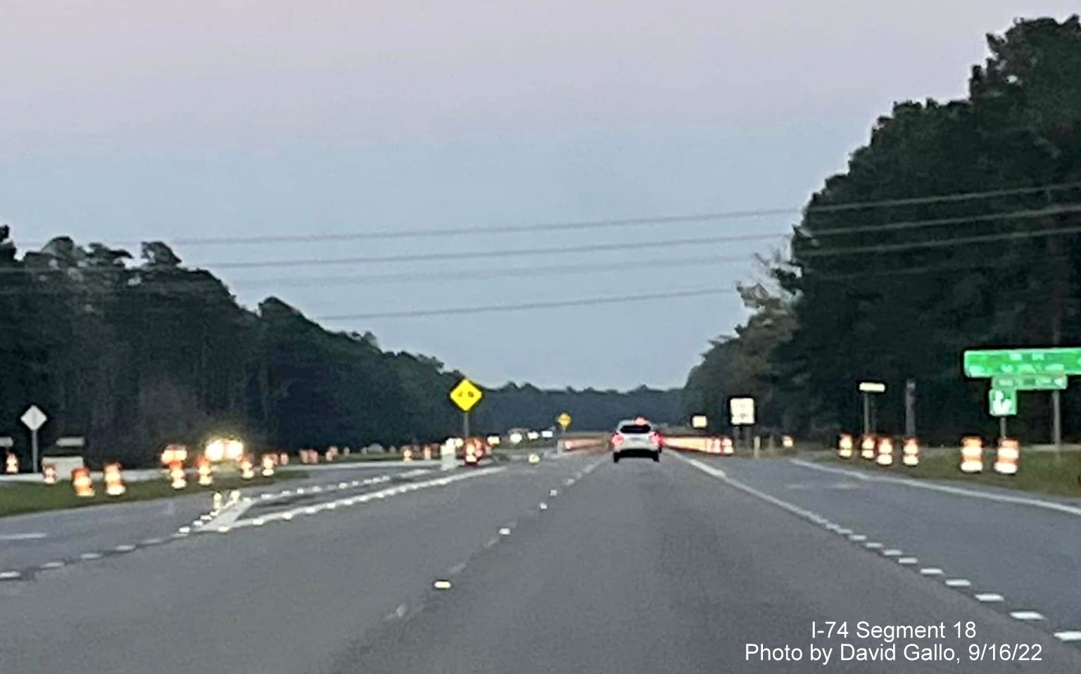 Image of construction barrels along US 74 West approaching Old Lake Road, by David Gallo, September 2022