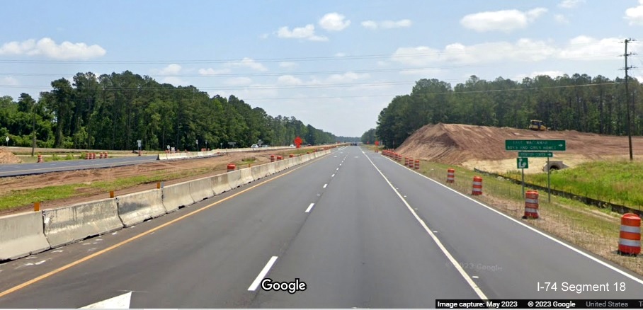 Image of start of bridge building approaching future site of Lake Waccamaw interchange  
          along US 74/76 East, Google Maps Street View, May 2023
