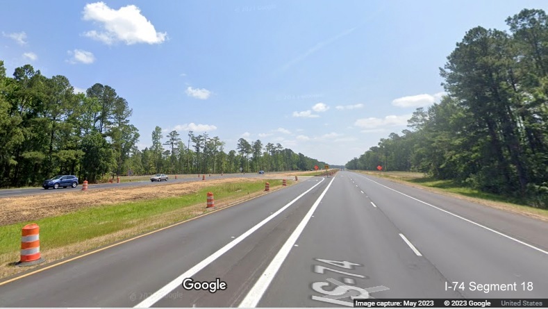 Image of reduced conflict intersection turn around for US 74/76 West after the Chauncey Town Road
        intersection in Lake Waccamaw on US 74/76 East, Google Maps Street View, May 2023