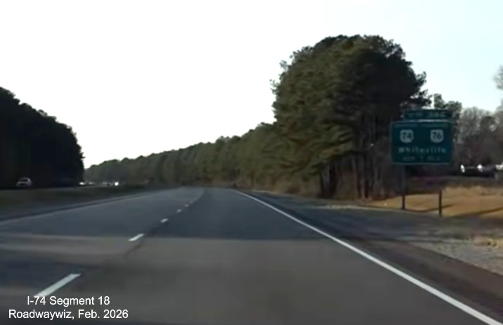 Image of ground mounted ramp sign for Lake Waccamaw exit at Chauncey Town Road 
	   on US 74/76 (Future I-74) West in Columbus County, Screen Grab from Roadwaywiz video, February 2026