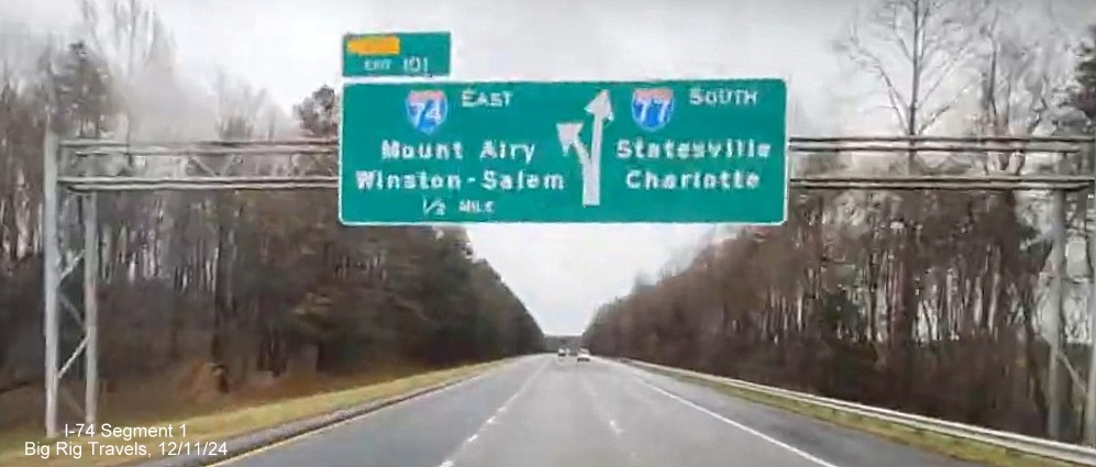 Image of 1/2 Mile advance overhead sign for East I-74/South I-77 ramp 
	  split, showing no change in exit numbers heading south in Surry County, Google Maps Street View image, December 2024