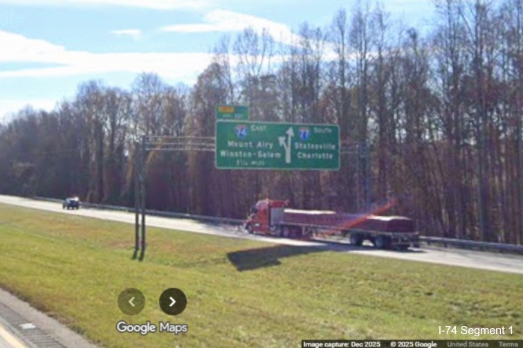 Image of unchanged exit number for I-74 East exit on overhead signage on I-77 South
	  in Surry County, Google Maps Street View, December 2025