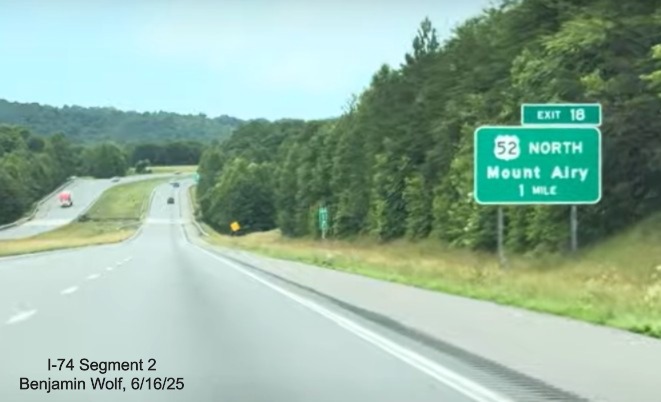 Image of renumbered exit sign for the US 52 North exit on I-74 East
with new I-74 milepost exit number, screen grab from video by Benjamin Wolf, June 2025