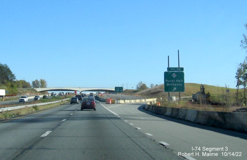 Image of signage on US 52 South for the NC 65 exit approaching the future 
       I-74/Winston-Salem Northern Beltway interchange in Rural Hall, October 2022