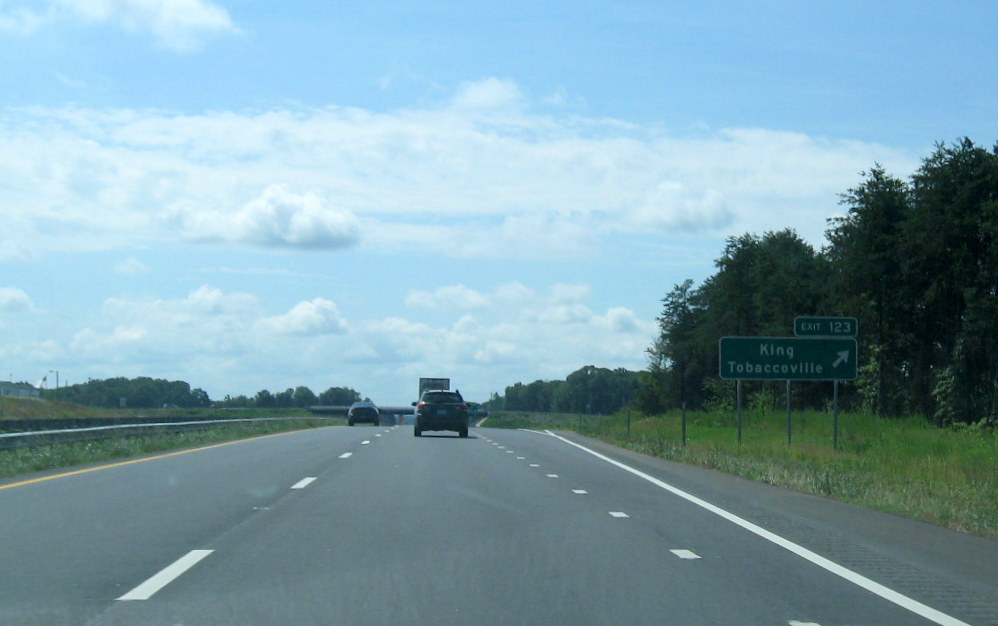 Photo of new exit signage placed in 2011 for rebuilt King/Tobaccoville Exit in
      July 2012