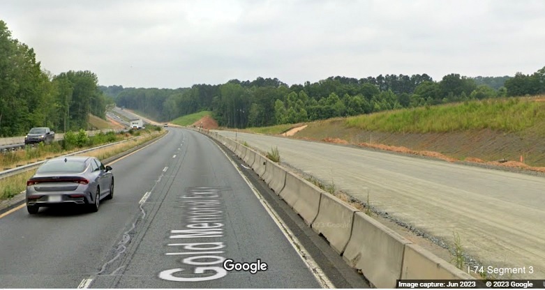 Image of US 52 North lanes under construction between NC 65 and Westinghouse Road 
	  as part of Winston-Salem Northern Beltway interchange project, Google Maps Street View, June 2023