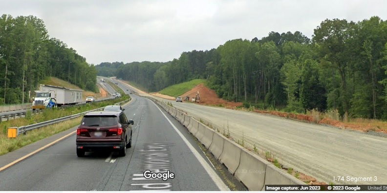 Image of US 52 North lanes under construction between NC 65 and Westinghouse Road 
	  as part of Winston-Salem Northern Beltway interchange project, Google Maps Street View, June 2023