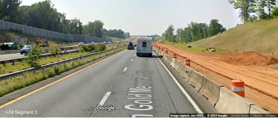Image of traffic on US 52 South approaching NC 65 exit under construction as 
	  part of Winston-Salem Northern Beltway interchange project, Google Maps Street View, June 2023