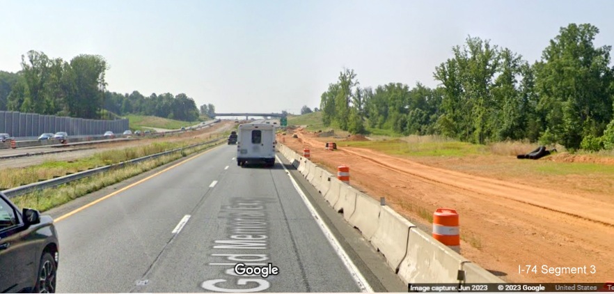 Image of traffic on US 52 South approaching NC 65 exit under construction as 
	  part of Winston-Salem Northern Beltway interchange project, Google Maps Street View, June 2023