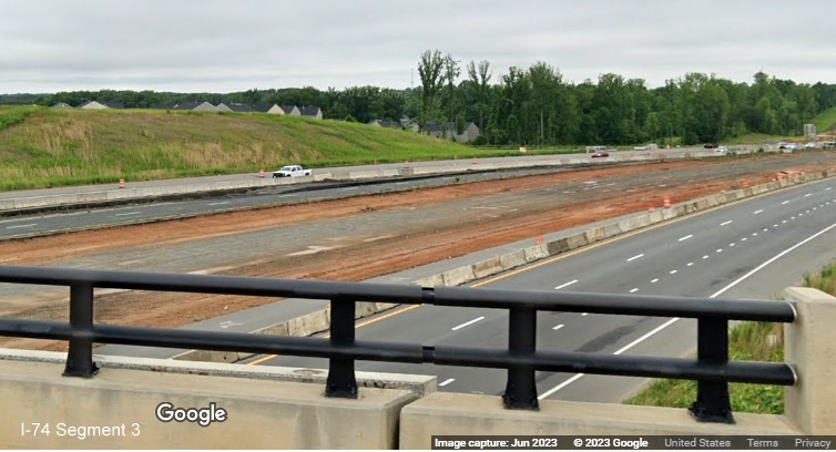 Image of traffic on US 52 South approaching NC 65 exit under construction as part 
	  of Winston-Salem Northern Beltway interchange project, Google Maps Street View, June 2023