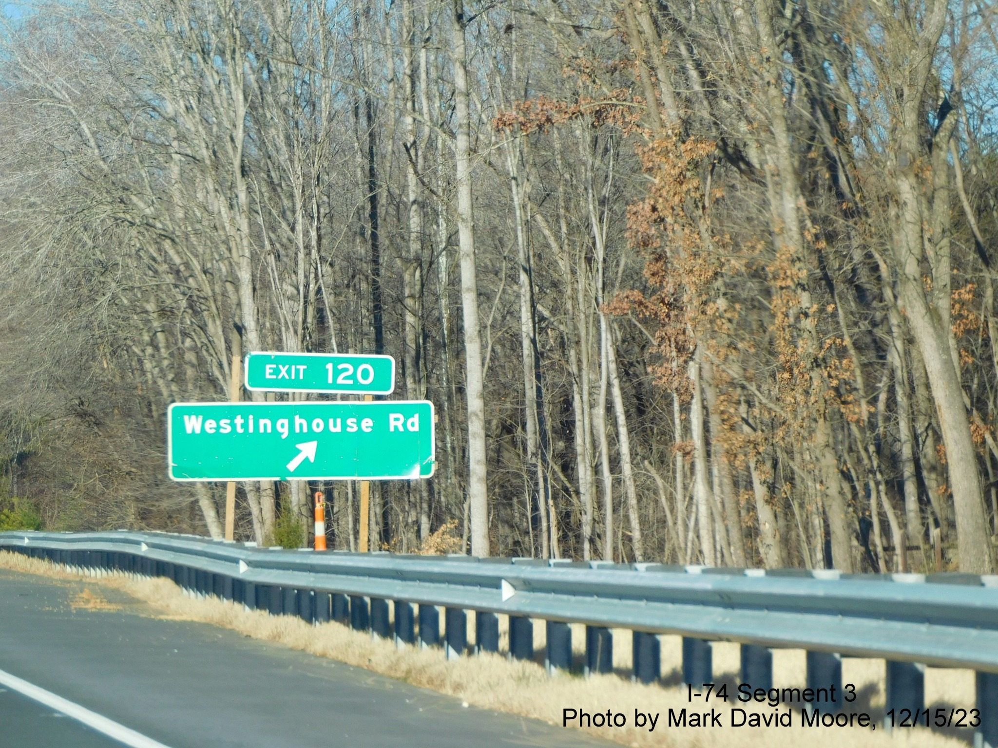Image of newly placed 1 mile advance sign for the Westinghouse Road exit along the widened 
       portion of US 52 North (Future I-74 West) beyond the Winston-Salem Northern Beltway interchange, by Mark David Moore, December 2023