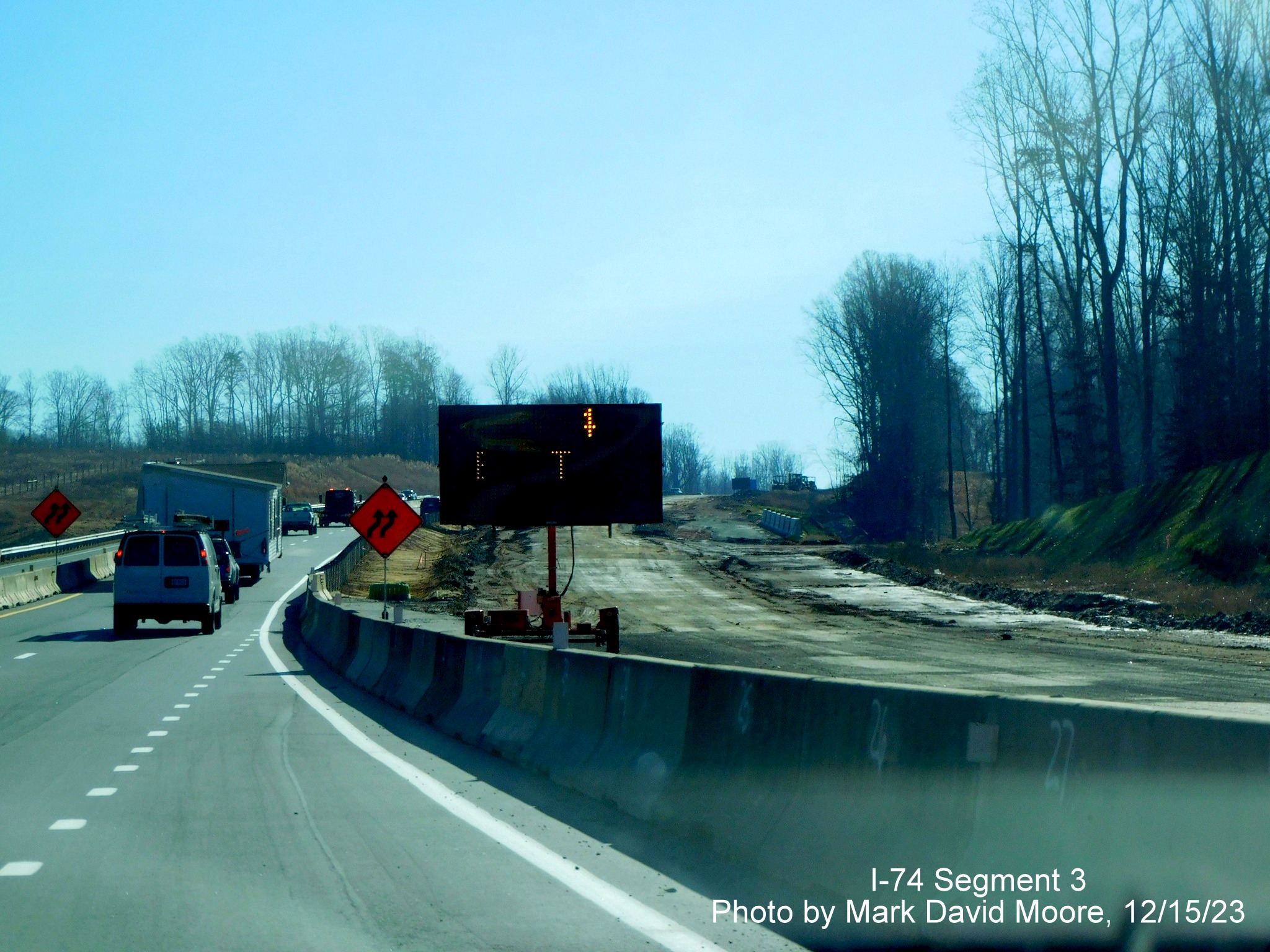 Image of temporary VMS advance sign for completed Winston-Salem Northern Beltway interchange
        after the NC 65 exit, by Mark David Moore, December 2023