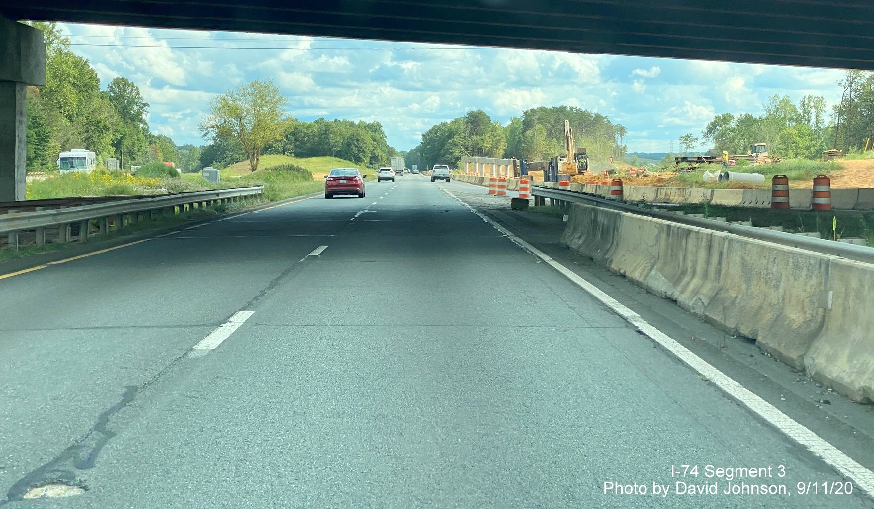 Image of driving under new NC 65 bridge over US 52, part of future I-74 Winston Salem Northern Beltway 
	  interchange construction, by David Johnson September 2020